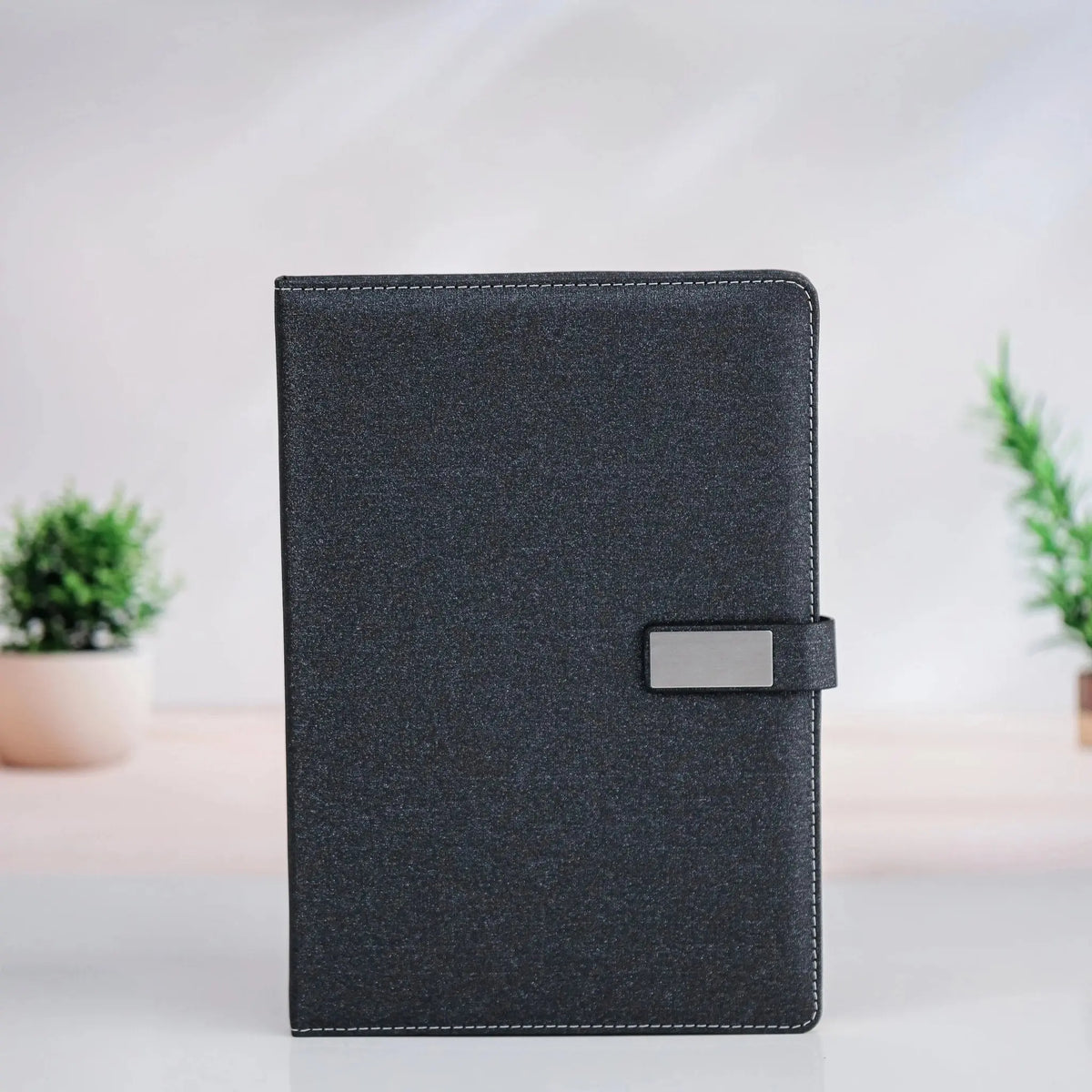 Elegant Black Textured Leather Notebook with Metal Clasp