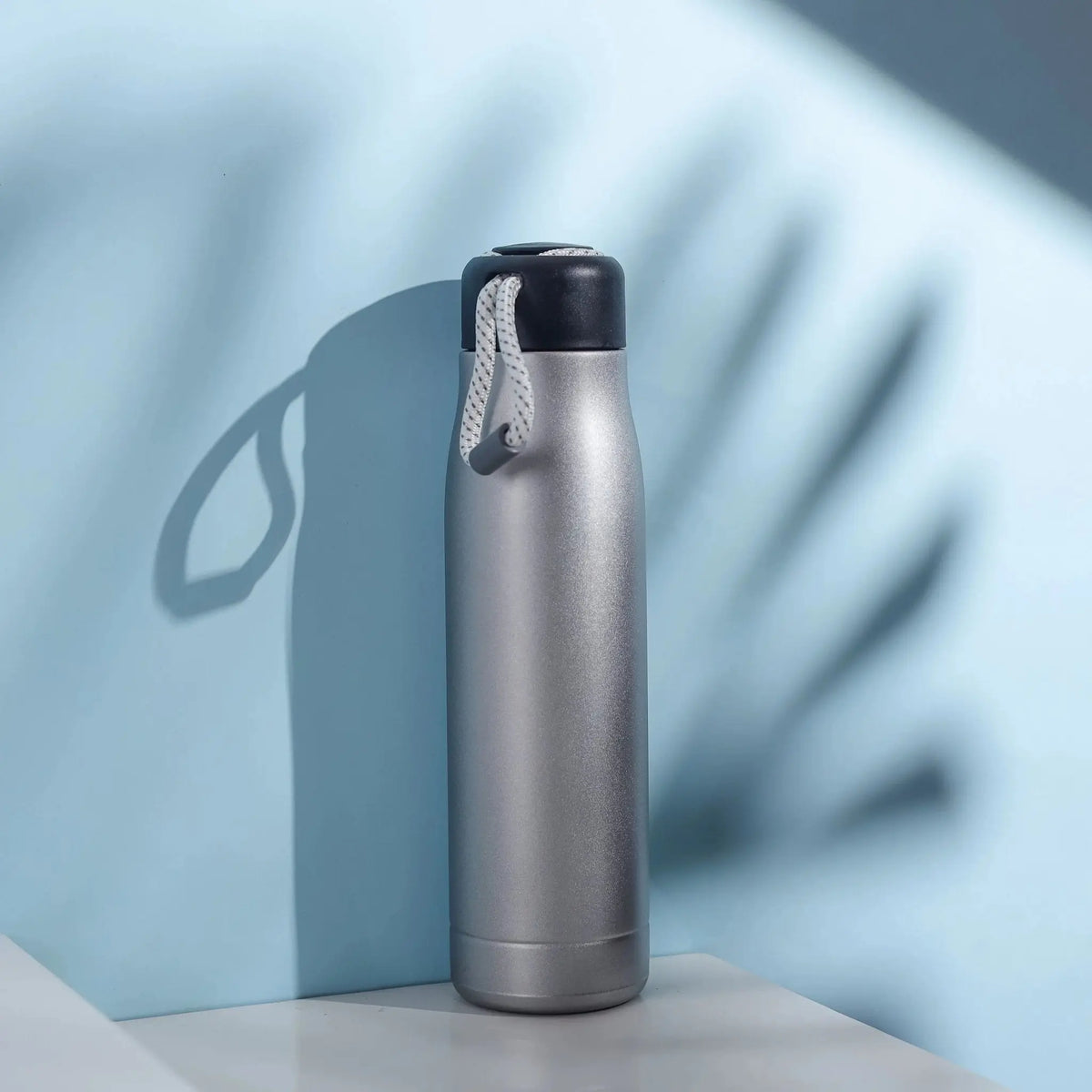 Sleek Silver Insulated Water Bottle with Carry Strap